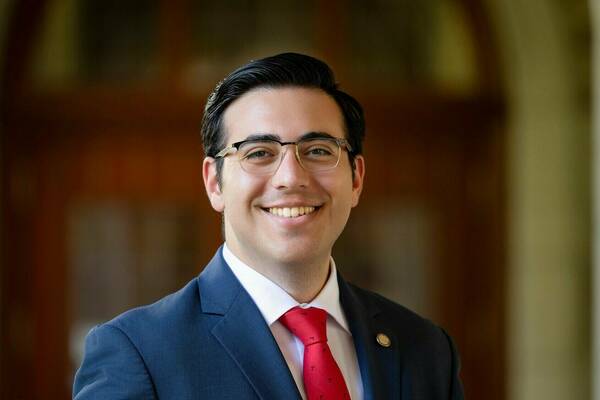 Man with glasses and red tie