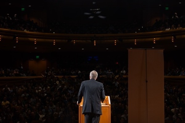 Man facing crowd