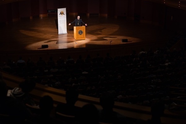 Man lecturing in auditorium