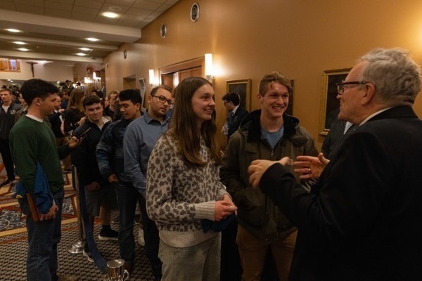 Guests lining up to meet Bishop Barron