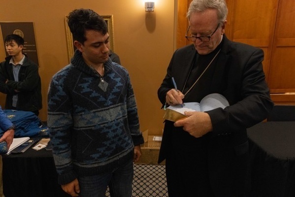 Bishop Barron signing book