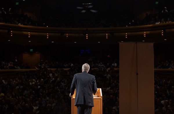 Bishop Robert Barron standing before the crowd at his Maritain Lecture, "Old Testament Doctrine of God"
