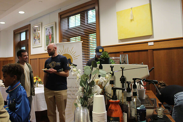 Guests standing around espresso bar